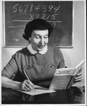Ann Cutler with her book on Trachtenberg Math System, ca. 1960