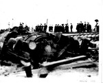 Overturned train engine and washout of railroad tracks following 1913 Flood