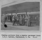 American Red Cross W.W. I Canteen feeding soldiers from a regular passenger train