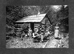 Family & log cabin along Big Sandy River by Thomas Luther