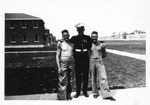 Image of three marines at camp, Earl F. Dickinson on right, June 1943