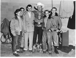 Roy Rogers with unidentified young men, Memorial Field House, ca.1951