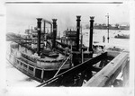 Two steamboats docked at a wharf, probably on Ohio River