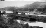 Steam tow boats moving coal barges on the Ohio River