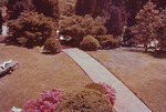 Owen Clinic Institute: Lawn chair and walkway by Marshall University Archives and Special Collections