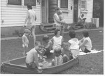 Children and parents at Donald Court, housing for married students at MU