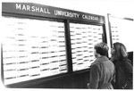 Students examining sympathy telegrams for MU plane crash victims, 1970