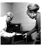 MU Speech Prof. Dr. George Harbold & Pam Via, grad student examine Audiometer