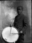 African-American boy holding a drum by Proctor Studios